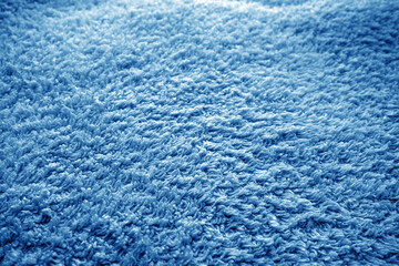 Fototapeta na wymiar Bath towel texture with blur effect in navy blue tone.
