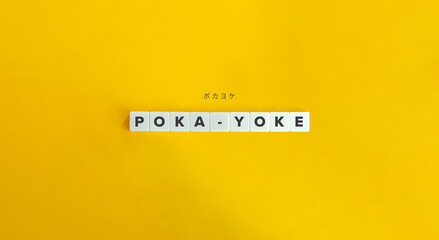 Poka-yoke (mistake-proofing) word on letter tiles on yellow background. Minimal aesthetics.
