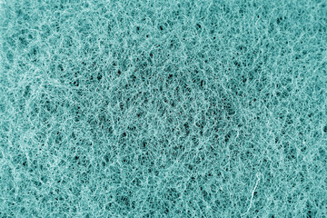Fototapeta na wymiar Cleaning sponge texture in cyan tone.