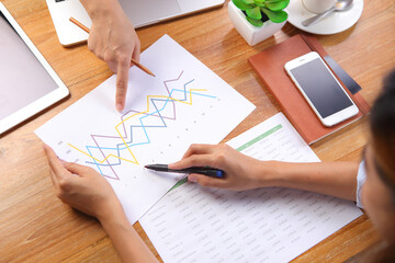 Business people discussing with financial report