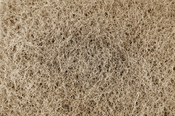Cleaning sponge texture in brown tone.