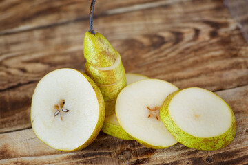 Fruit yellow ripe pear, cut into pieces. Vegetarian diet.