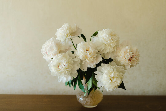White peonies in vase at home