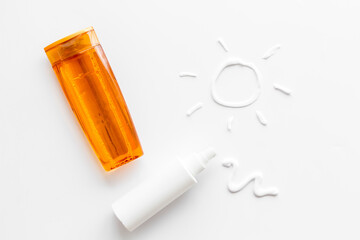Suntanning lotion with cream in shape of sun, top view