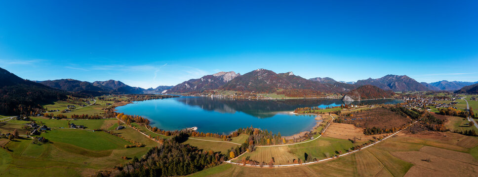 Austria, Salzburg, Sankt Wolfgang im Salzkammergut, Drone panorama of Lake Wolfgang and Blinklingmoos