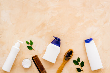 Female hair care set with shampoo and brush, flat lay