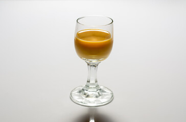 a glass of caramel alcohol