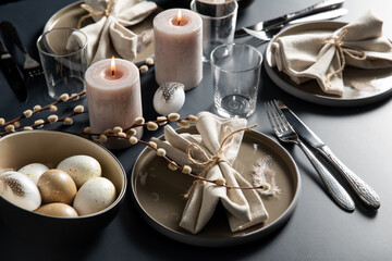 easter, holidays, tradition and object concept - close up of dinner party table serving over black background