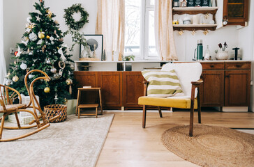 County house kitchen interior, with armchair and fireplace, cosy winter decoration.