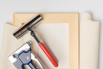 A tool for stretching canvas on a wooden frame, top view