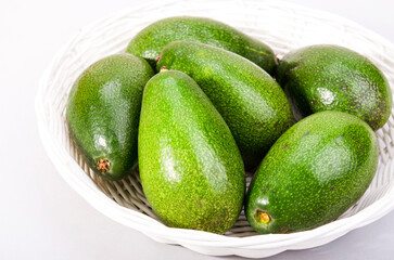 avocado on the table in a plate on a light background