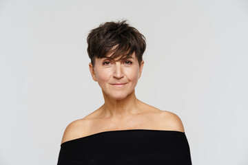 Mature european woman smiling and looking at camera