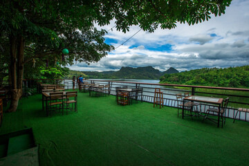 Panoramic nature background (mountains, sea, trees, twilight lights in the sky, waterfront communities), naturally blurred through the wind, seen on tourist spots or scenic spots