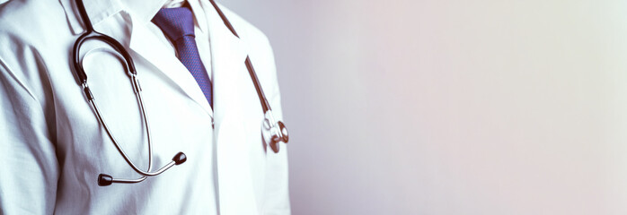 Stethoscope doctor medical background. Happy nurse in hospital uniform, blue gloves holding stethoscope isolated on white. Medicine service and healthcare concept.