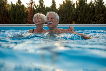Senior couple enjoying pool time.