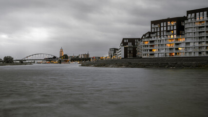 The skyline of the city of Deventer on the river with the church rising above it