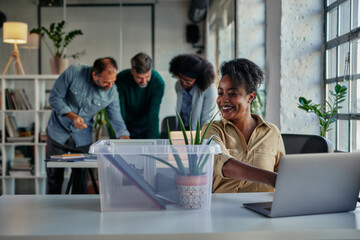 African businesswoman setting office table in business environment