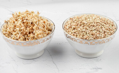 Green buckwheat. Two plates, one with sprouted whole grains in the other. View from above. Alternative types of flour without gluten. raw food diet
