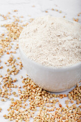 Flour green buckwheat on a light concrete background top view. Green Buckwheat Flour - Gluten Free Alternative Flour