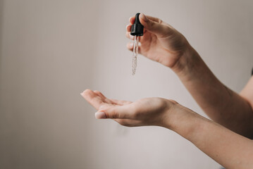 facial oil on a white background. Pipette
