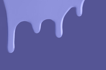 Light blue liquid drops of paint color flow down on isolated very peri background. Abstract violet backdrop
