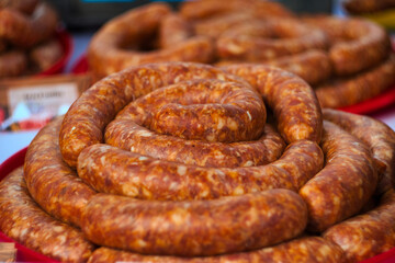 Ham, hamon iberico, pancetta, chorizo, kulen, prsut i fresh kobasice sausages on the traditional meat food market in Belo Blato, Serbia