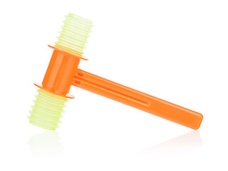 Children's plastic orange hammer on a white background. Toys that attract the child's attention with different sounds. Development of hearing and attention in a child