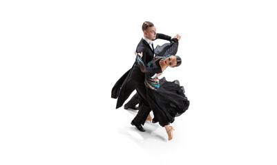 Aerial view of young graceful artistic couple, man and woman dancing waltz isolated over white studio background. Ballroom dances - obrazy, fototapety, plakaty