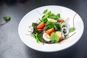 salad quail egg tomato mix leaves vegetable healthy meal food snack on the table copy space food background keto or paleo diet veggie vegan or vegetarian food