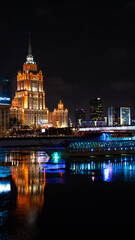 Naklejka na ściany i meble night view of the city with river and boat