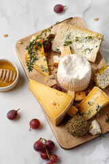 Assortment of cheese shropshire , langre, asiago, gorgonzola, shanklish cheese. Cheese plate with...