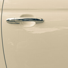 contemporary beige car door and chrome handle, space for your text