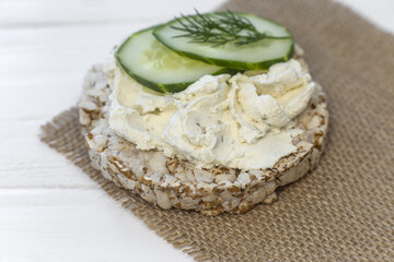 Crispy wheat crackers with a dill, spread and  cucumber. Natural Diet Bread