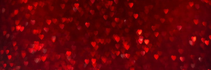 Red hearts, sparkling glitter bokeh background texture. Holiday valentines day lights. Abstract defocused header. Wide screen wallpaper. Panoramic web banner with copy space for design