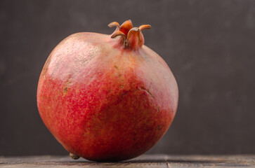 Whole big red pomegranate fruit.