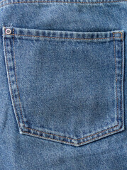 Fototapeta premium Jeans pocket texture close up, blue denim pants