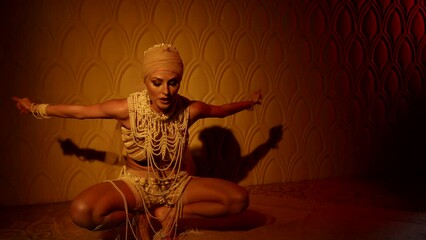 alluring dance performer lady is dancing alone in night in oriental harem, ancient fairytale and myth
