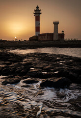 Fototapeta premium Tostón Lighthouse at sunset, El Cotillo, La Oliva, Fuerteventura, Canary Islands, Spain 