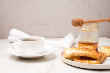 Croutons for breakfast with honey and coffee.