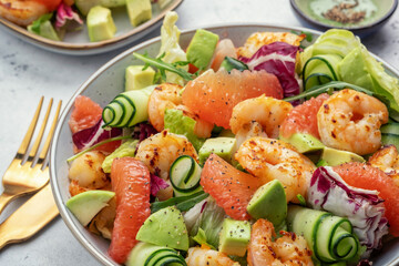 Delicious fresh salad with shrimp prawns, grapefruit, avocado, cucumber and green salad. Healthy food.