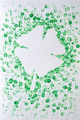 children's card DIY for St. Patrick's Day. four-leaf clover with spots of green paint. art craft for kids.