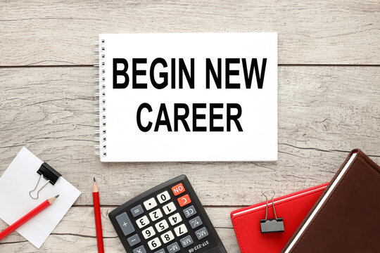 Begin new career open notepad with text on rustic background near calculator and other supplies