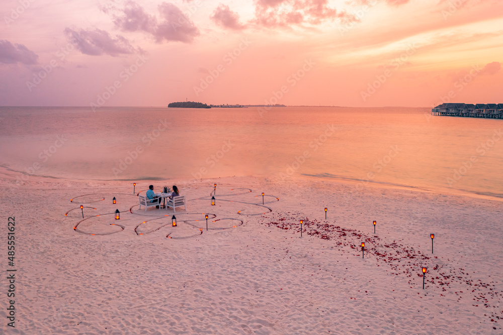 Wall mural honeymoon couple at private luxury romantic dinner on tropical beach in maldives. seaside, amazing i