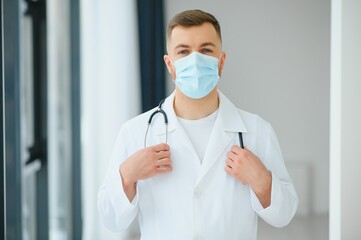 close up portrait of medical doctor in mask with copy space