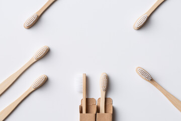 Set of ECO friendly wooden bamboo toothbrushes. Save the planet or NO plastic concept. Isolated on white background.