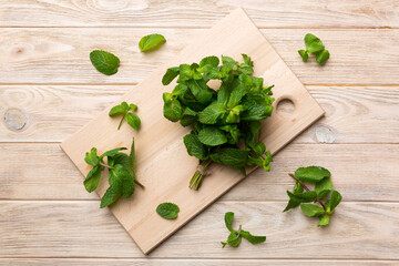 Fresh mint on Cutting board table, top view. Flat lay Space for text