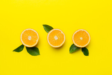 fresh Fruit orange slices on colored background. Top view. Copy Space. creative summer concept. Half of citrus in minimal flat lay with copy space