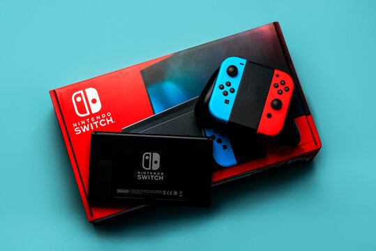 Nintendo Switch video game console box with Nintendo Switch logo, Back of Nintendo Switch and two Joy-Cons