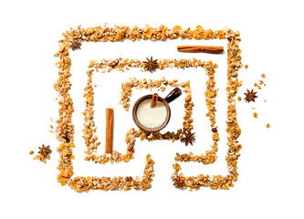 maze or labyrinth made out of cereals with a cup of milk in the middle isolated over white...