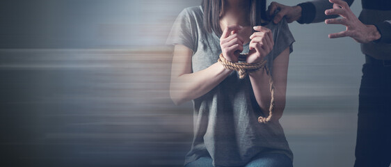 the man tied the woman's hands. concept of violence